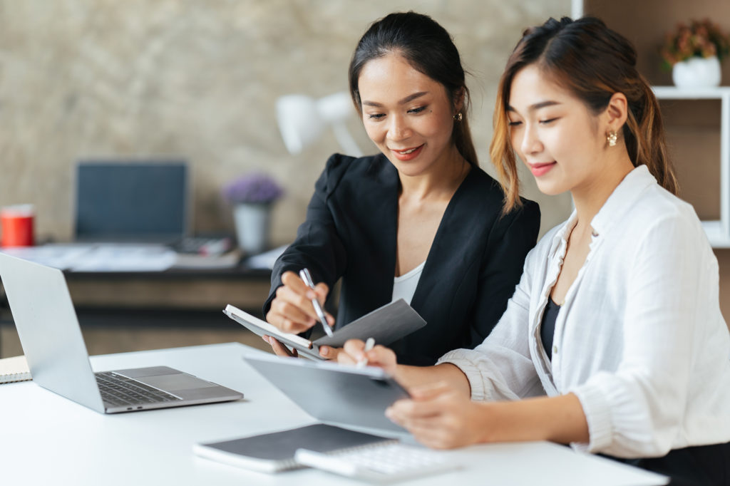 two women processing batch payments
