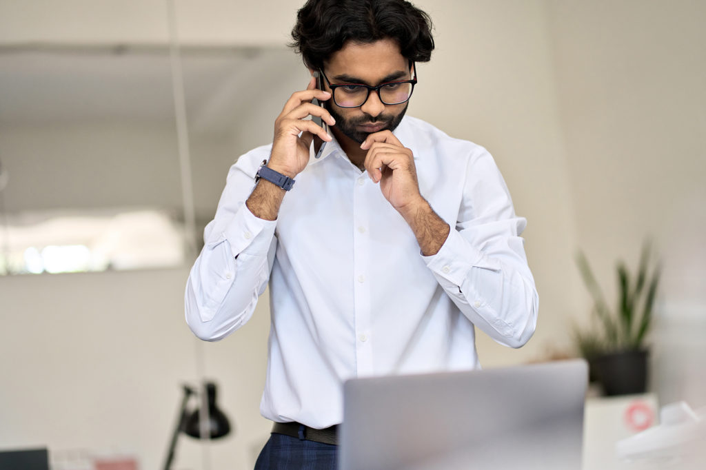 man calculating the costs of wire transfers