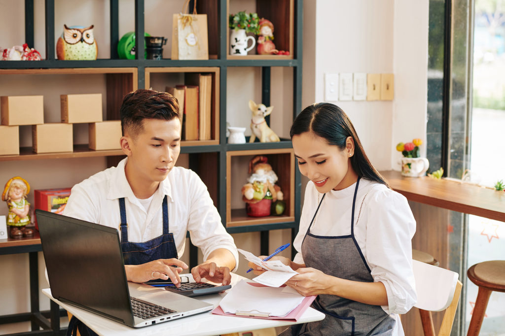 business owners looking at incoming wire transfer statements