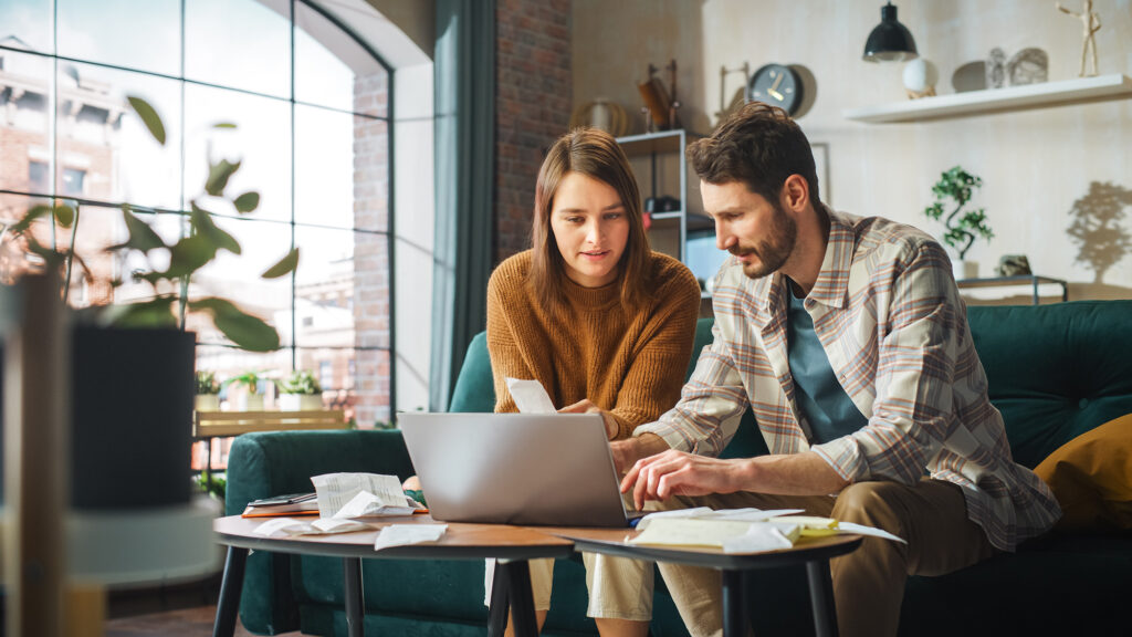woman and man calculating accounts receivable turnover